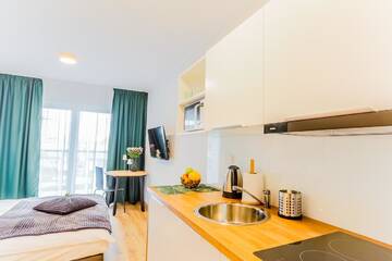 Фото номера Стандартный номер-студио Апарт-отели COIN Apartamenty Krakowska г. Вроцлав 4